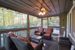 This peaceful screened in porch is perfect for reading and bird watching